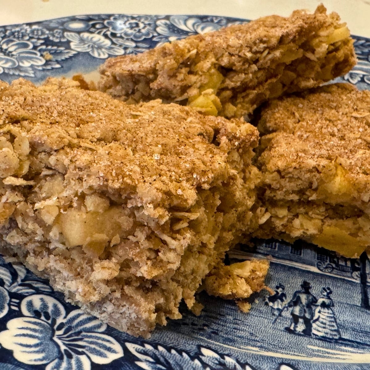 sourdough apple breakfast bars sliced into squares served on a blue plate