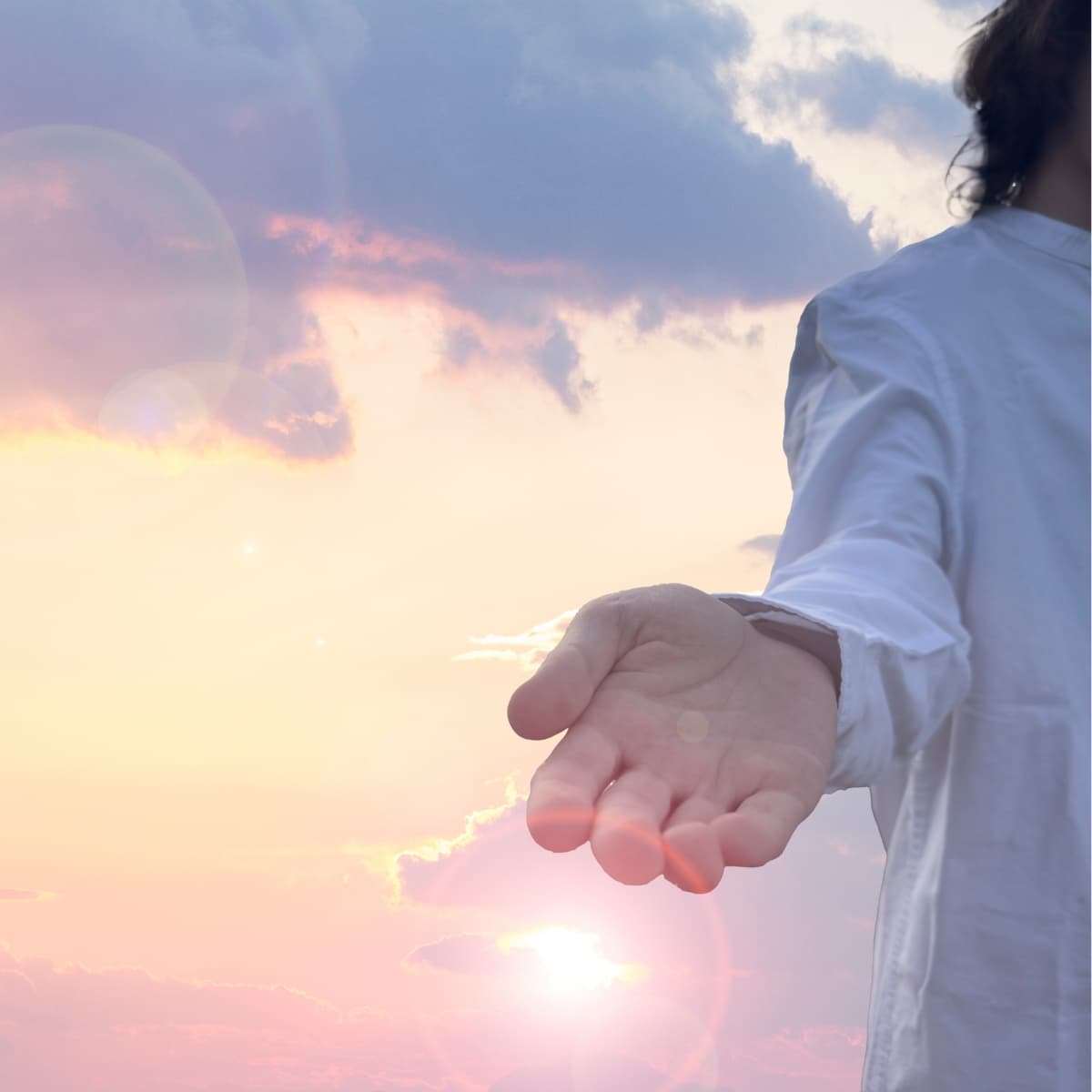 man in white with hand outstretched