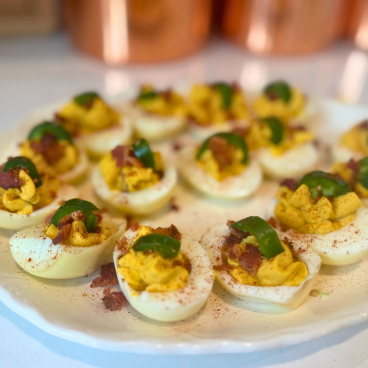 bacon jalapeno deviled eggs on a platter up close