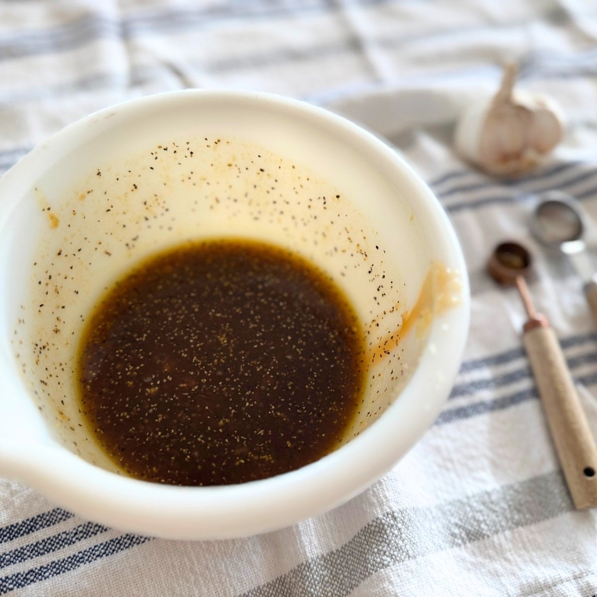 marinade mixed in small bowl on kitchen twoel