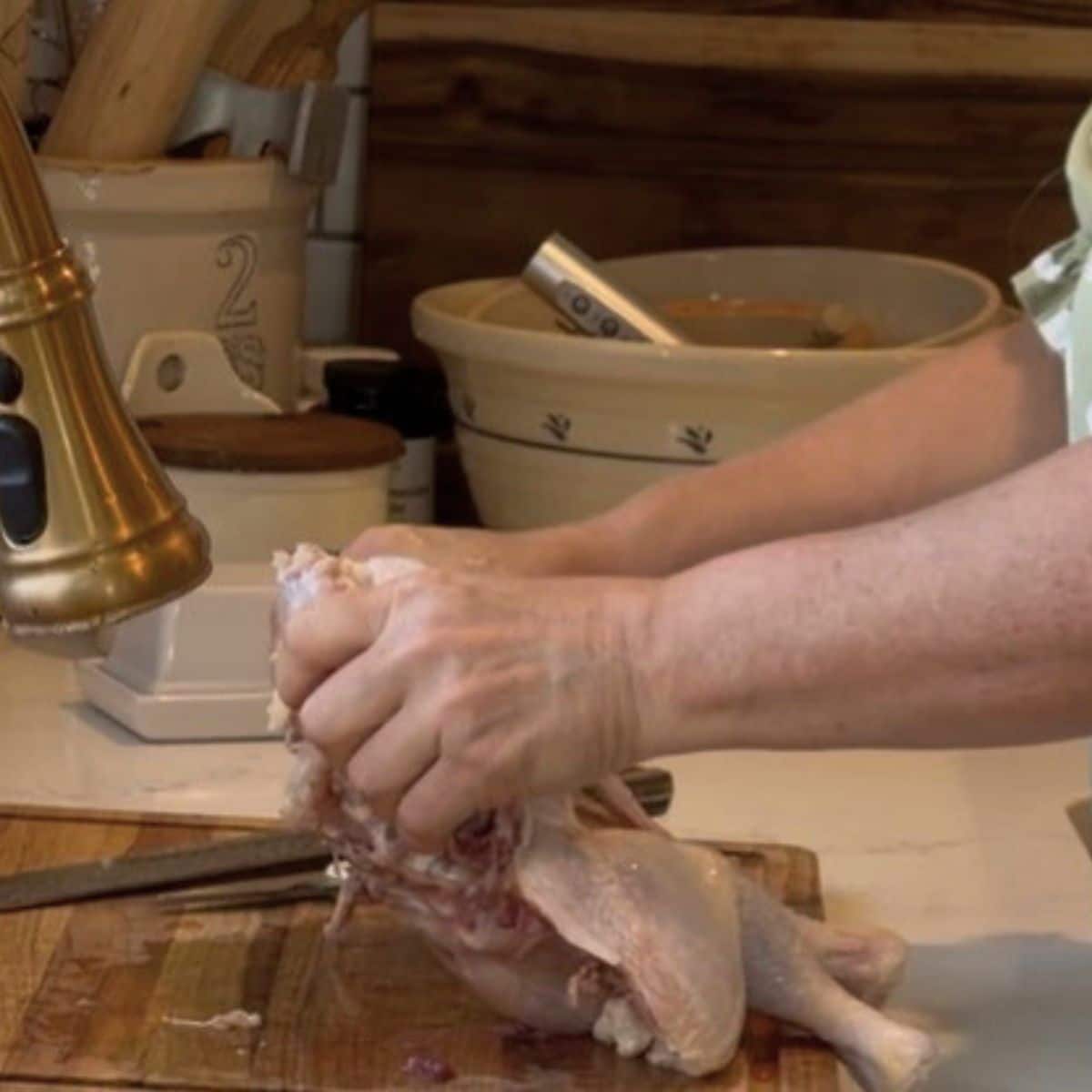 spatchcocking a chicken breaking breast bone to lay fat