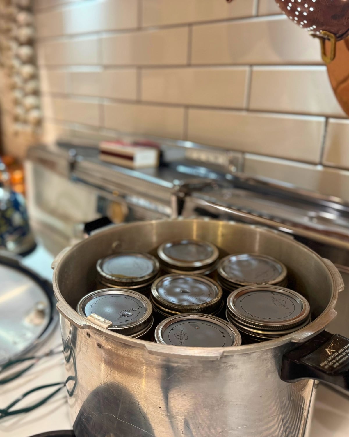 pressure canner loaded with jars