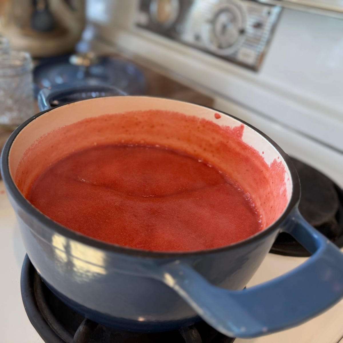 strawberry puree turned into jam with pectin added and boiled for 2 minutes in blue pot