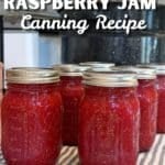 6 pint sized jars of hot raspberry jam canning reicpe with water bath canner in background and text that says: Beginners rasperry jam canning recipe step by step