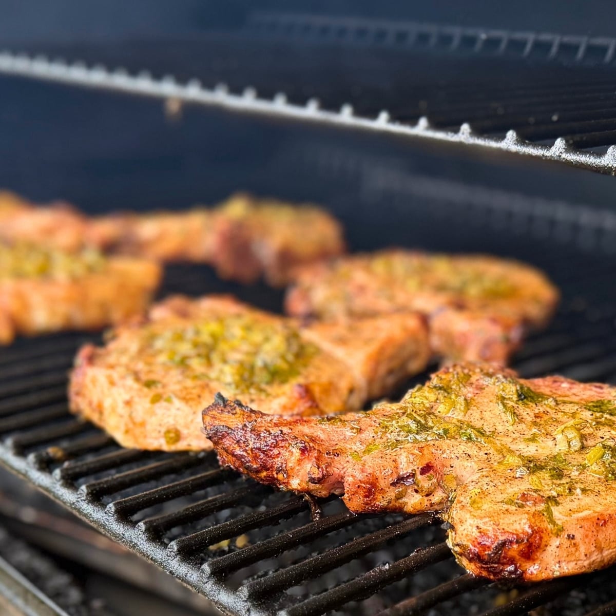 cilantro lime marinated grilled bone-in pork chops on the grill
