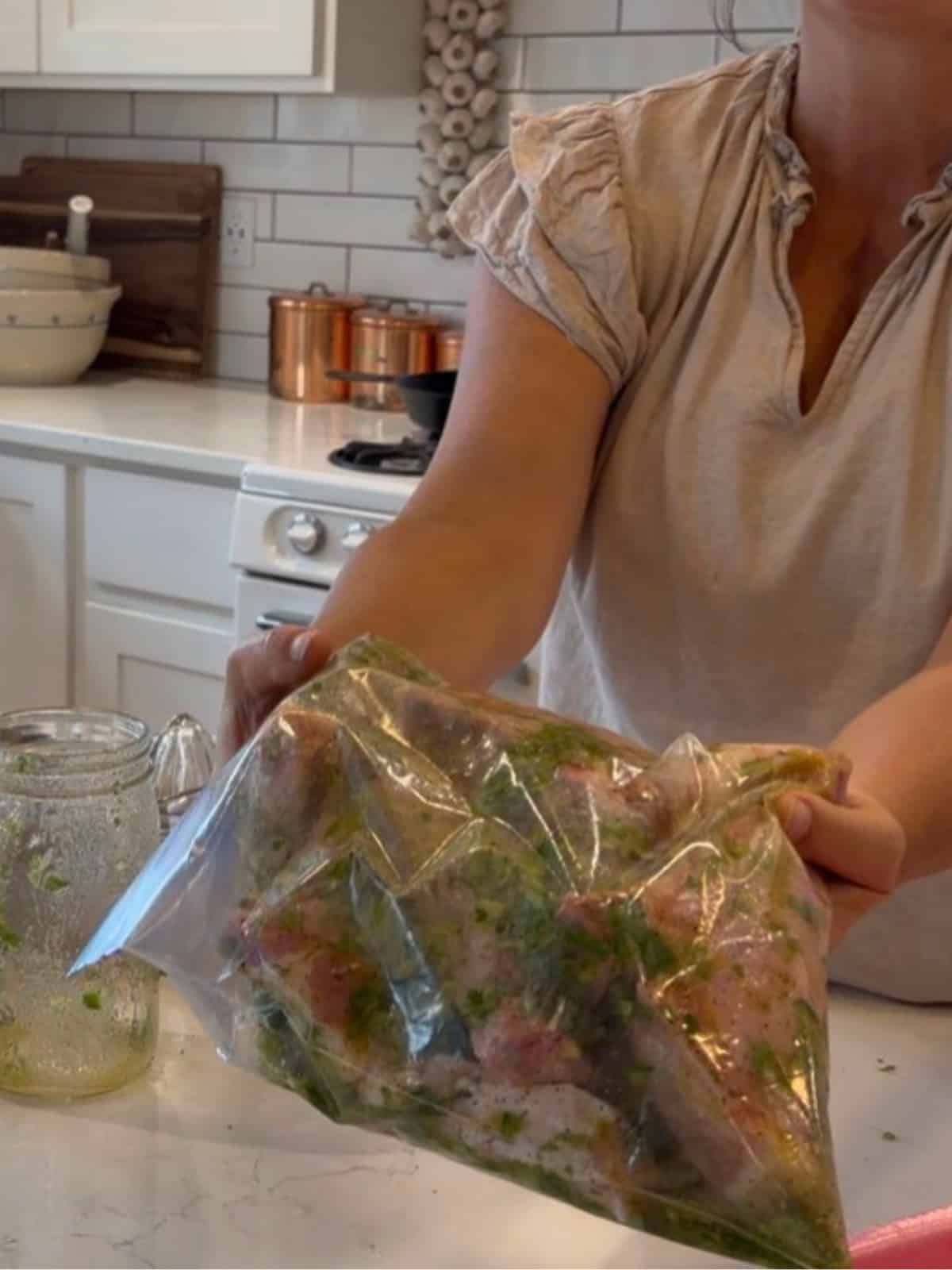cilantro lime marinade in zip lock bag with pork chops marinating
