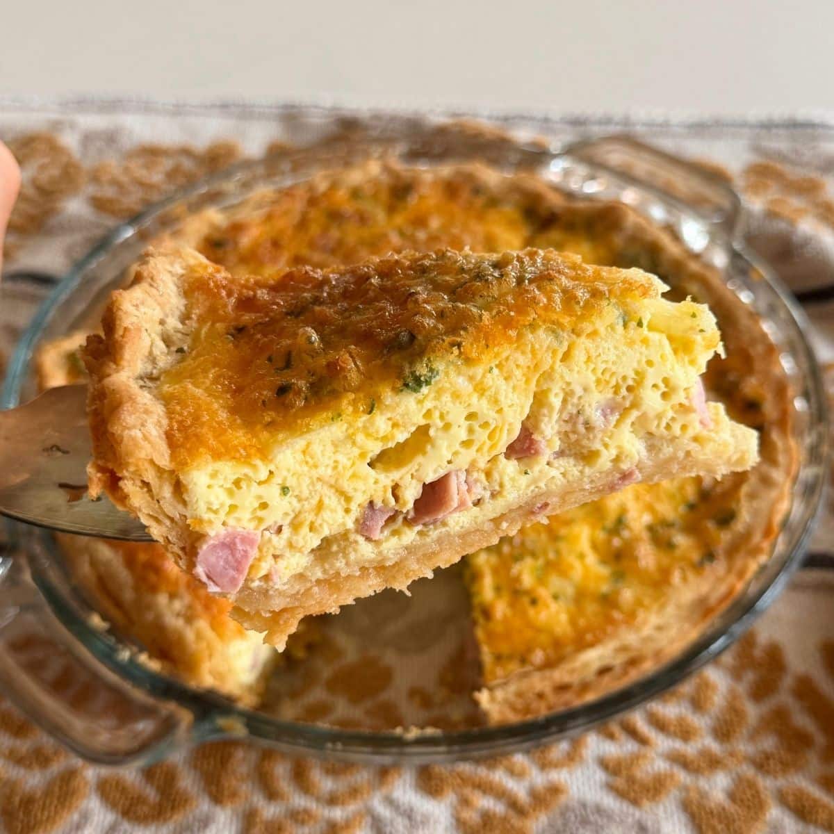 easy quiche with ham and cheese sliced up close to show texture