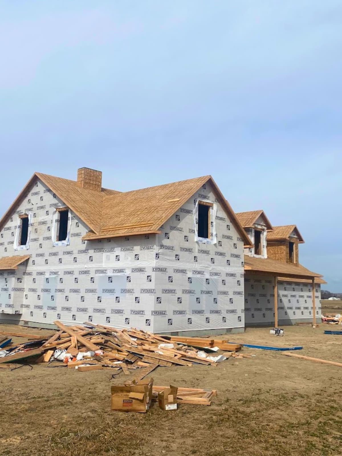 our famrhouse framed up and covered with water vapor barrier papper