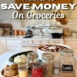 "A variety of preserved and stored foods on a farmhouse counter, including dried plums in a dehydrator, jars of beans, lentils, and mushrooms, alongside garden vegetables and homemade jam. This image illustrates traditional, budget-friendly kitchen habits.