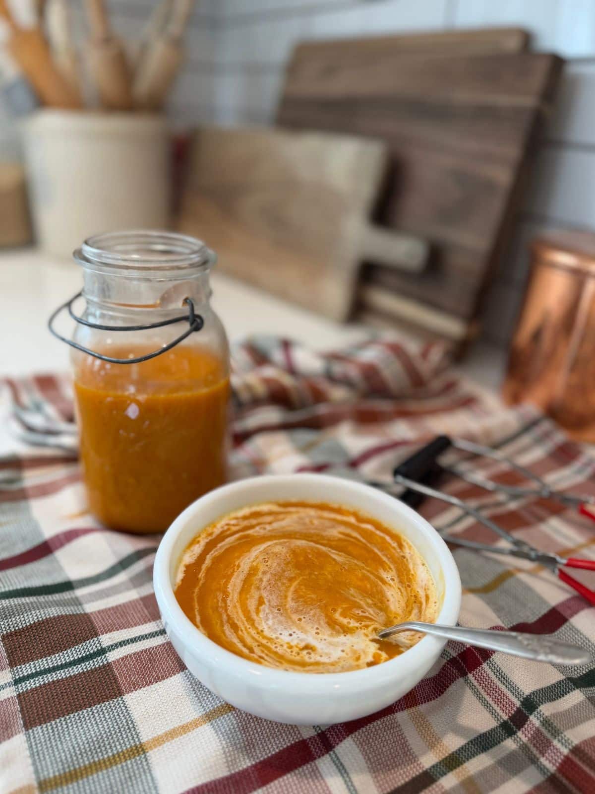 serving butternut squash soup canning recipe blened smooth with cream in a white bowl