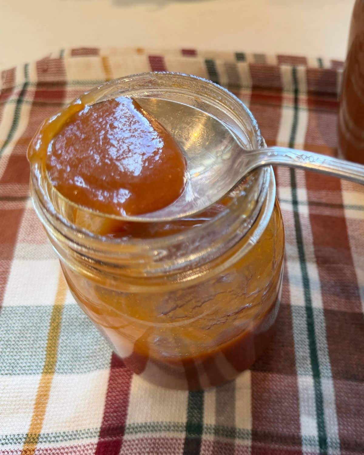 peach butter on a spoon