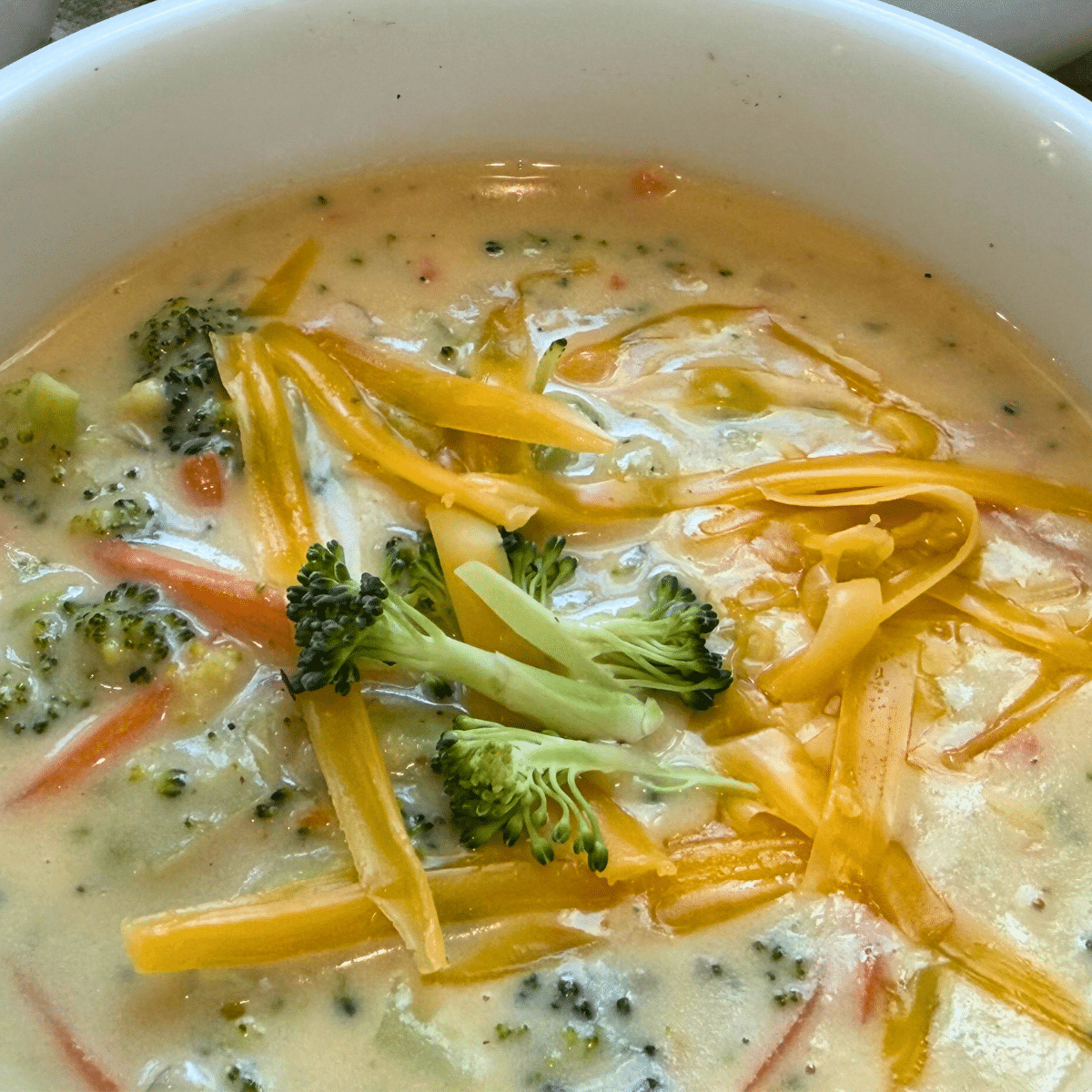 broccoli cheddar soup recipe served in a white bowl